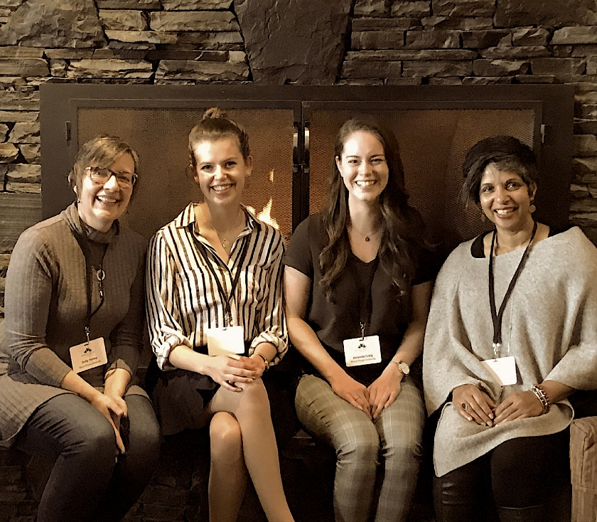 A photo shows the authors sitting in front of a fireplace.